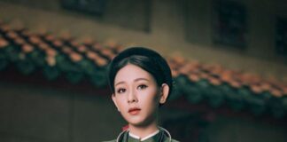 TOP 7 Studio chụp ảnh áo dài cổ phục đẹp ở Huế một cô gái mặc áo tấc màu xanh rêu