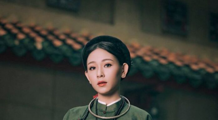 TOP 7 Studio chụp ảnh áo dài cổ phục đẹp ở Huế một cô gái mặc áo tấc màu xanh rêu